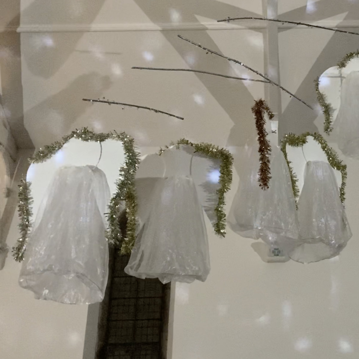 models of angels suspended from the ceiling of a church.